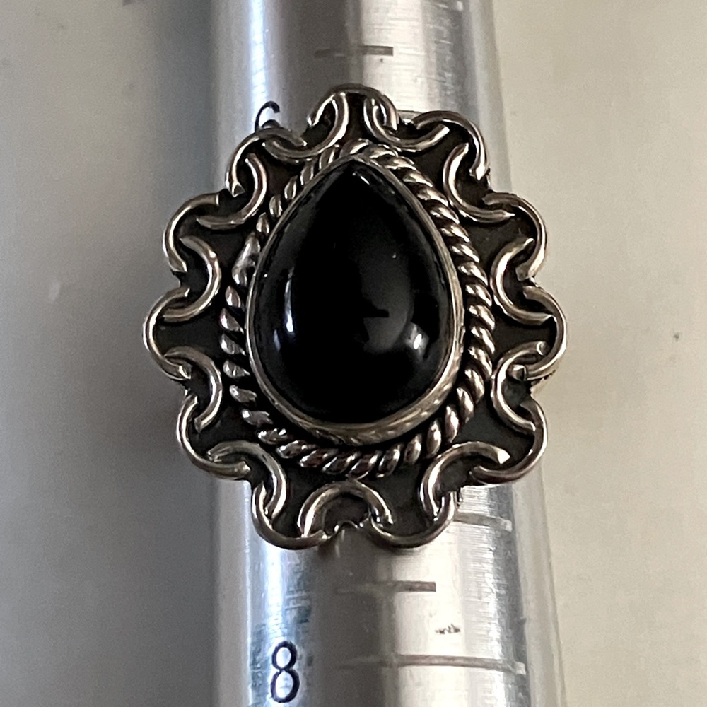 Lovely onyx gem in filigreed sterling silver bezel setting